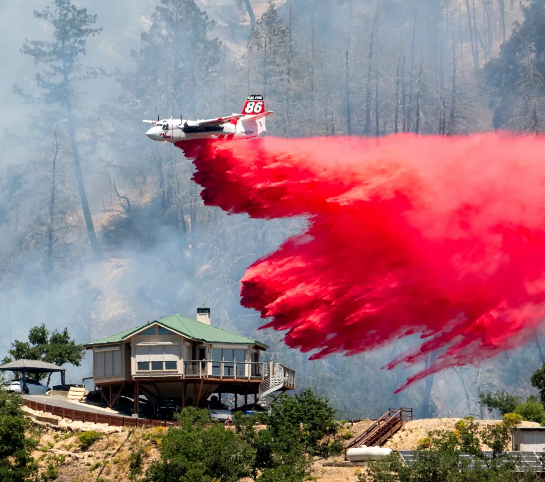 A firefighting plane putting out a fire