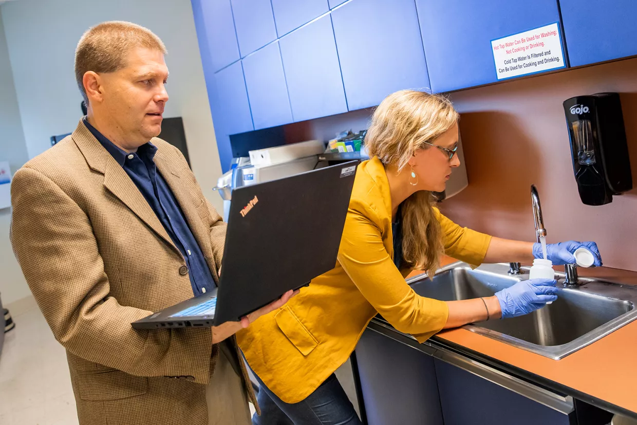 Members of the Clean Water for Carolina Kid team conduct water sampling.