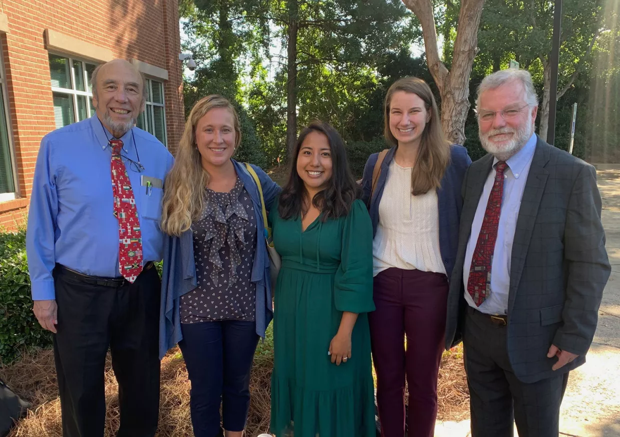 The Clean Water for Carolina Kids team stands outside of the building where the testing rule was just approved in September 2019. From left to right is Tom Vitaglione (NC Child), Jennifer Hoponick Redmon (RTI), Vikki Crouse (NC Child), Nancy Lauer (Duke), and Ed Norman (NC DPH).