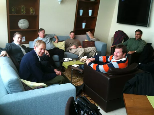 men sitting in chairs