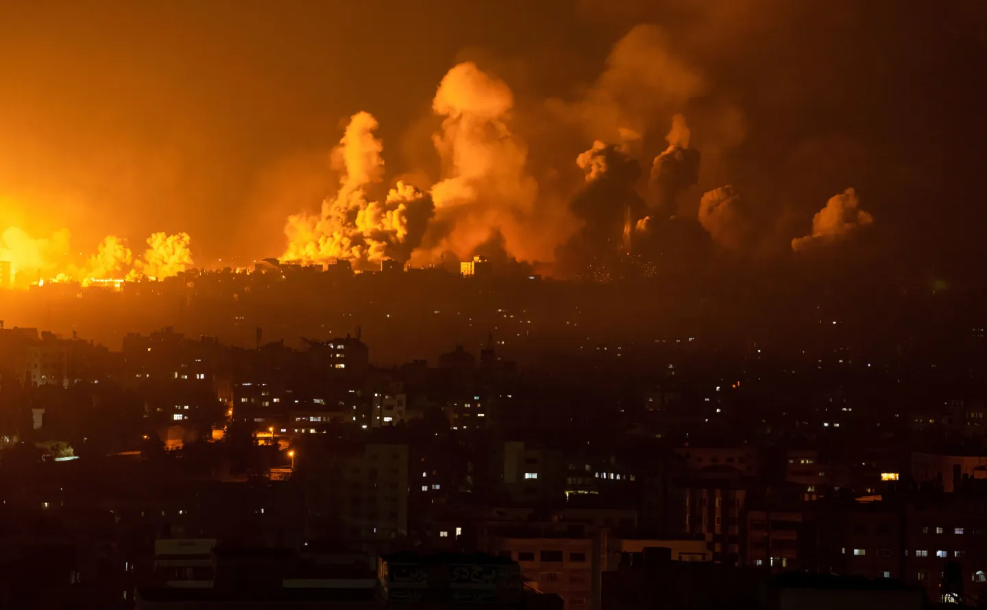 Fire and smoke rise following an Israeli airstrike in Gaza City, Sunday, Oct. 8, 2023. (AP Photo/Fatima Shbair)