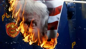 Protesters burn a portrait of U.S. President Donald Trump during a rally at the U.S. Embassy to mark the Feb. 4, 1899, Filipino-American War, Saturday, Feb. 4, 2017 in Manila, Philippines.