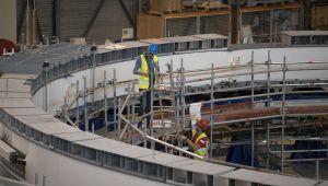 Technicians work on the poloidial field coil assembly line at the ITER (the International Thermonuclear Experimental Reactor) in Saint-Paul-Lez-Durance, southern France, Tuesday, July 28, 2020.