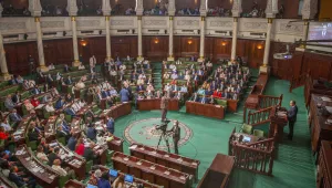 Tunisian designated Prime Minister Hichem Mechichi, right, delivers his speech at the parliament before a confidence vote in Tunis, Tuesday, Sept. 1, 2020.