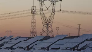 solar panels are seen near the power grid in northwestern China