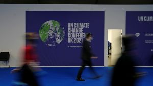 Delegates walk through the venue of the COP26 U.N. Climate Summit in Glasgow, Scotland