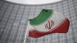 A national flag of Iran waves in front of the building of the International Atomic Energy Agency, IAEA, in Vienna, Austria, Friday, Dec. 17, 2021. 