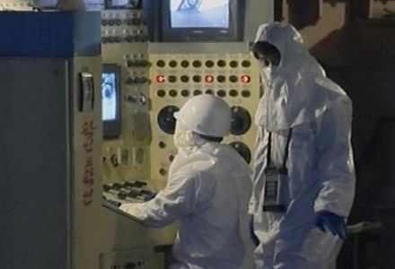 North Korean workers operate equipment at North Korea's main nuclear reactor in Yongbyon in February 2008