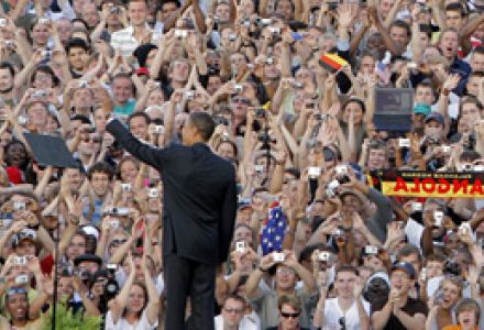 U.S. flags are waved while some 200,000 people turn out for a speech by then U.S. Presidential Candidate Barack Obama, entitled “A World that Stands as One” in Berlin, Germany, on July 24, 2008.