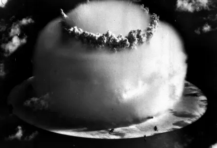 A huge mushroom cloud rises above Bikini atoll in the Marshall Islands following an atomic test blast.