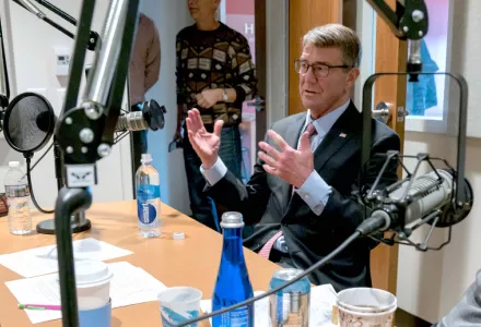 Lisa Perry, left, interviews Secretary Ash Carter, center, and her grandfather, Secretary William Perry, right, for the podcast "At the Brink."