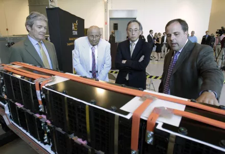U.S. Energy Secretary Steven Chu, second from right, listens as Jason Forcier, right, Vice President and General Manager of A123 Systems, shows off a battery